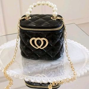 Mini heart bucket bag.